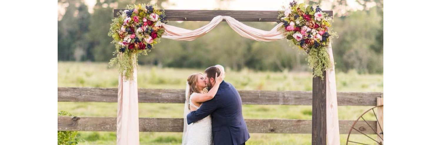 bride and groom kissing after saying "I do"